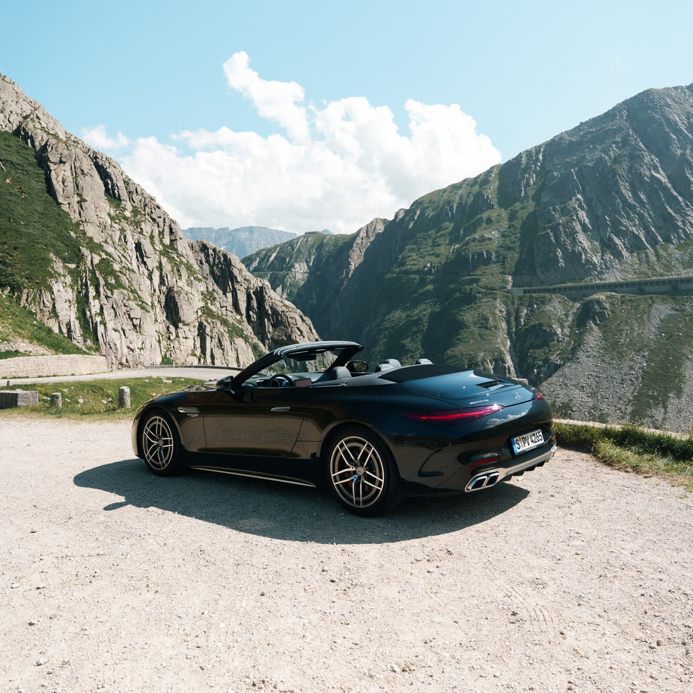 Mercedes-AMG SL63 parked on a mountain pass in the Swiss Alps